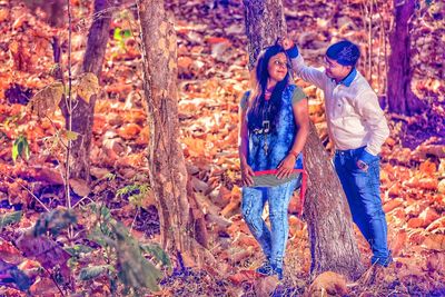 Full frame shot of young woman standing in forest