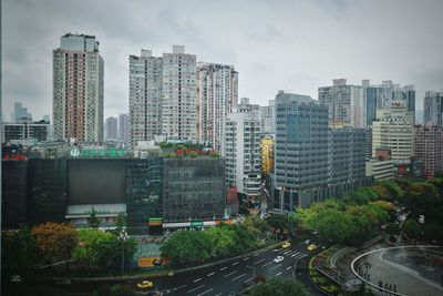 High angle view of buildings in city against sky