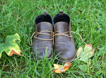 Low section of shoes on field