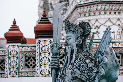 Statue of temple in building