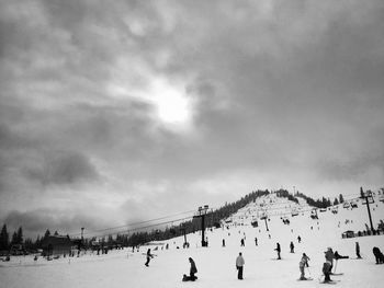 People on snow covered landscape