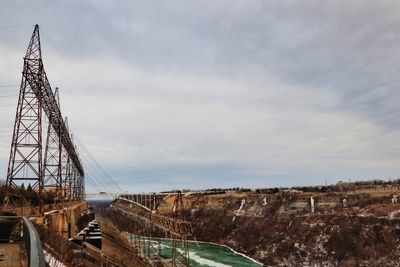 View of bridge against cloudy sky