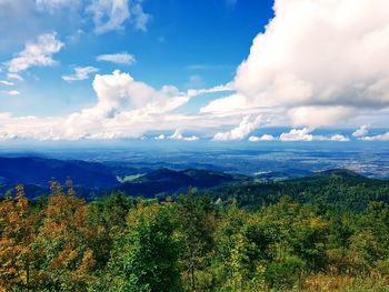 Scenic view of landscape against cloudy sky