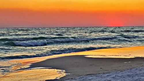 Scenic view of beach during sunset