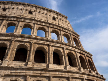 Low angle view of coliseum against sky