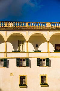 Low angle view of building against blue sky