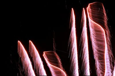 Low angle view of illuminated lights at night