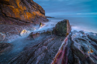 Panoramic view of rock formations against sky