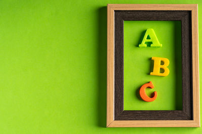 Close-up of toys over green background