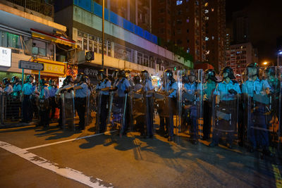 Group of people in city at night