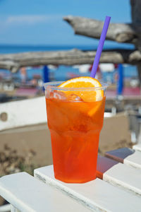 Close-up of orange juice on table