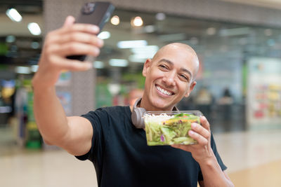 Portrait of young woman drinking wine