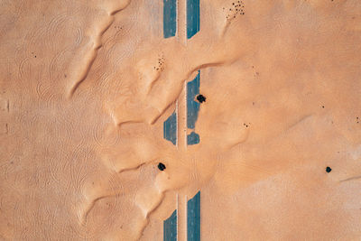 High angle view of sand at beach