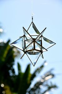 Crystal suncatcher against blue sky