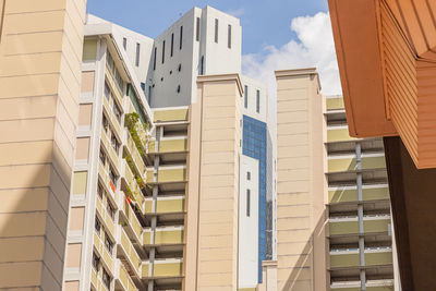 Low angle view of hdb flat in city against sky during an afternoon 