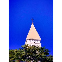 Low angle view of traditional building against clear blue sky