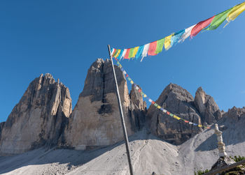 Low angle view of prayer flags on mountain
