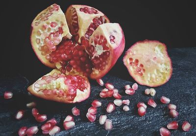 Close-up of strawberries on table against black background