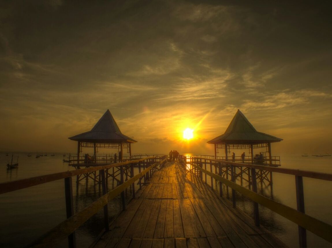 sunset, sea, water, horizon over water, sky, pier, beach, scenics, orange color, tranquility, tranquil scene, beauty in nature, the way forward, sun, built structure, idyllic, nature, railing, incidental people, shore