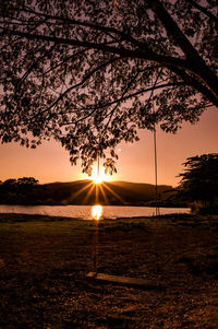 Silhouette tree against sky during sunset