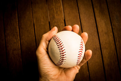 Close-up of hand holding ball