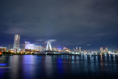 Illuminated city buildings at night