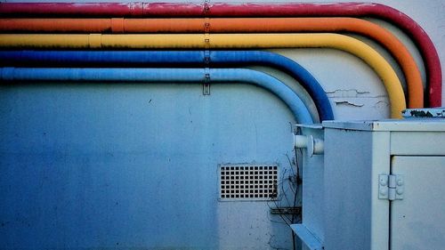 Close-up of blue pipe on wall