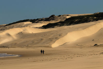 Scenic view of desert against clear sky