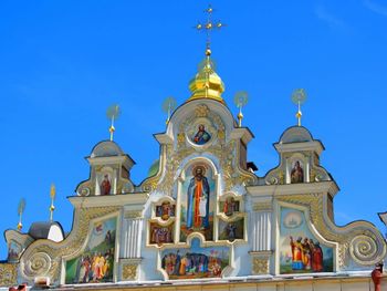 Low angle view of church against blue sky