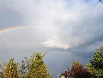 Low angle view of rainbow against sky