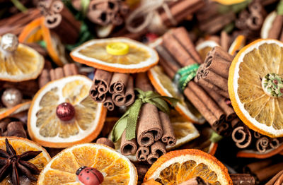 Christmas background of dried fruits and spices, dried lemon, anise stars and cinnamon sticks