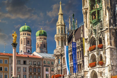 Panoramic view of buildings in city against sky