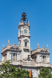 Low angle view of historic building against clear blue sky