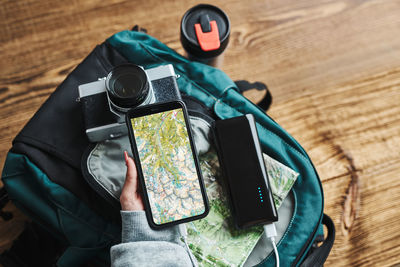 Woman planning next vacation trip while journey. searching travel destination using map on mobile