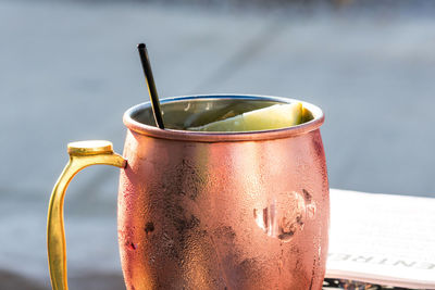 Closeup of a moscow mule mixed drink in a copper mug