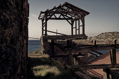 Built structure on beach against sky