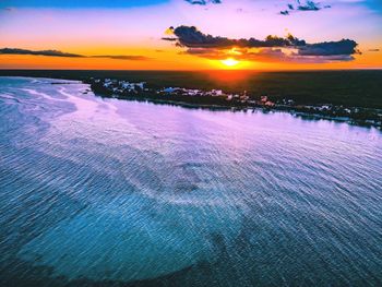 Scenic view of sea against sky at sunset