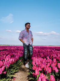 Full length of man standing on field against sky