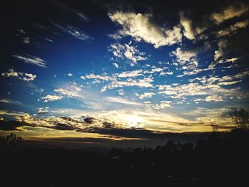 Scenic view of silhouette landscape against sky during sunset