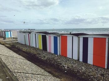 Beach huts against sky