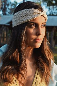 Portrait of young woman in hat