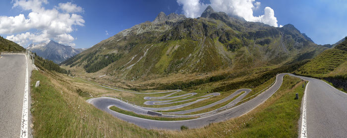 Panoramic view of road amidst mountains against sky