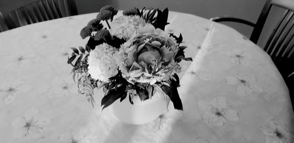 High angle view of white rose on table