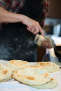 Cropped image of person preparing food