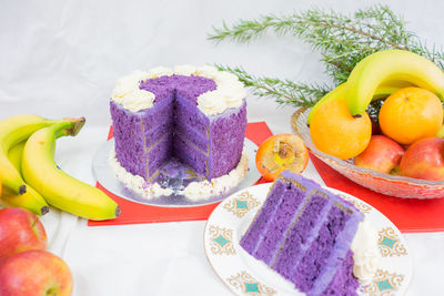 Close-up of cake and fruits on table during christmas