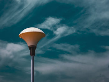 Low angle view of street light against sky