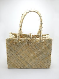 Close-up of wicker basket on white background