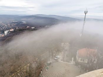 High angle view of buildings in city against sky