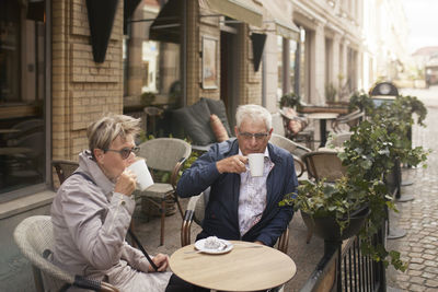 Mature couple having coffee