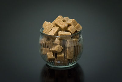 Close-up of bread against black background